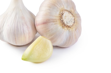 Fresh garlic closeup isolated on a white backgroundの写真素材