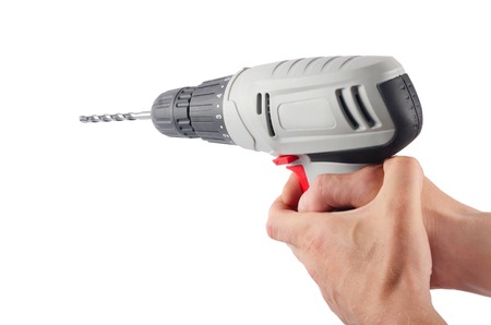 Drill the hand of a man isolatedの写真素材
