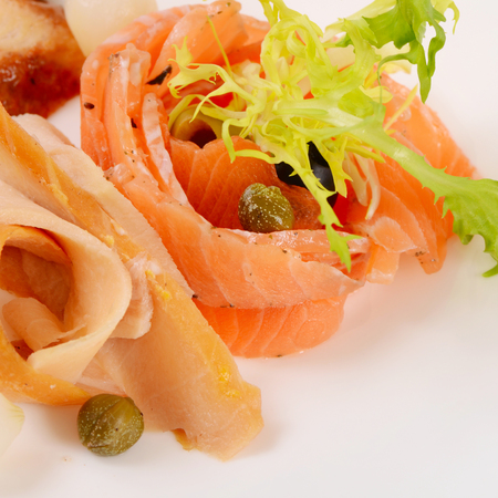 Cutting different fish in the restaurant macroの写真素材