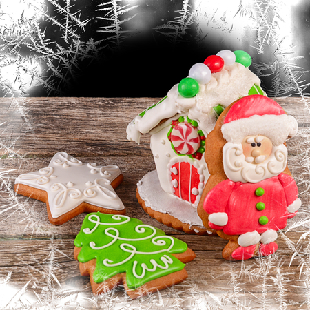 The gingerbread house on a wooden backgroundの写真素材