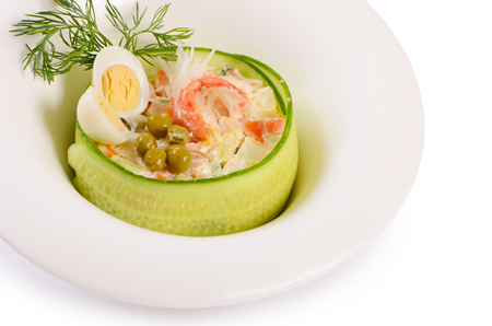 Salad Olivier closeup with eggs and cucumberの写真素材