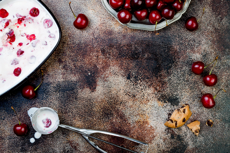 Preparing Black Forest roasted cherry ice cream sandwiches with chocolate chip cookies. Copy space, overhead, top viewの写真素材
