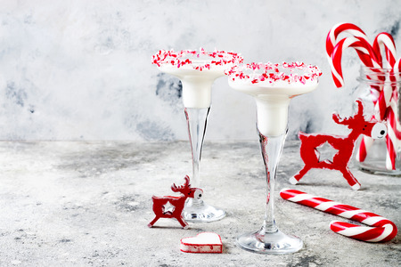 White chocolate peppermint martini with candy cane rim. Christmas holiday party drink ideaの写真素材
