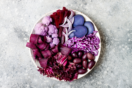 Purple Buddha bowl with spiral carrots, cauliflower, beet, onion, potato, shredded red cabbage, radicchio salad, kalamata olives. Vegan detox veggie bowlの写真素材