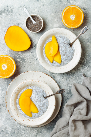 Healthy breakfast set. Chia seed pudding bowls with mango.の写真素材