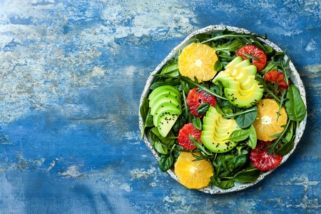 Citrus salad with mixed greens and blood orange. Vegan, vegetarian, clean eating, dieting, food concept.の写真素材