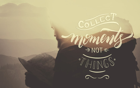 Composite image with overlaid hand drawn lettering. Phrase Collect moments not things on beautiful mountain landscape background with stylish bearded traveler with map in hands. Double exposure. Inspirational  poster for your designの写真素材