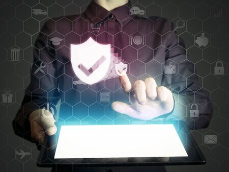Image of a girl with a tablet in hands and shield icon. Data privacy, online security, protection concept.の写真素材