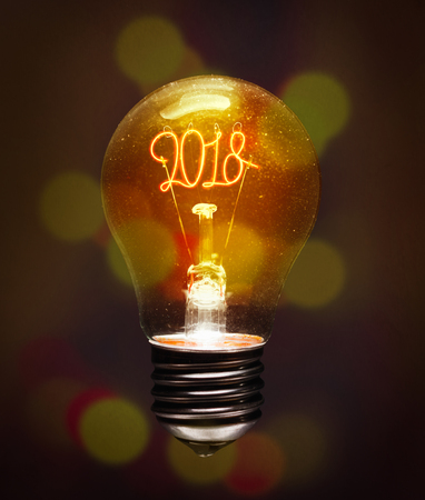 The concept of the new 2018. Filament  lamp in the form of numbers 2018. Made in the hygge style. An excellent choice for the design of postcards.の写真素材