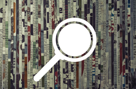 Icon of magnifier cut from newspaper. Concept of search anything.の写真素材