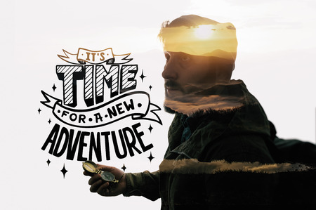 Double exposure mountain landscape with bearded traveler and lettering. Metaphor of travel.の写真素材
