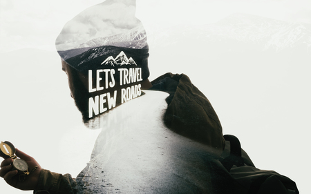 Double exposure mountain landscape with bearded travele, road and lettering. Metaphor of travel.の写真素材