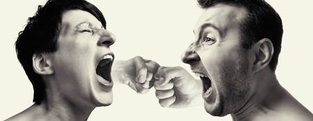 Man and woman yell at each other on light background. Male and female fists on the back burner.