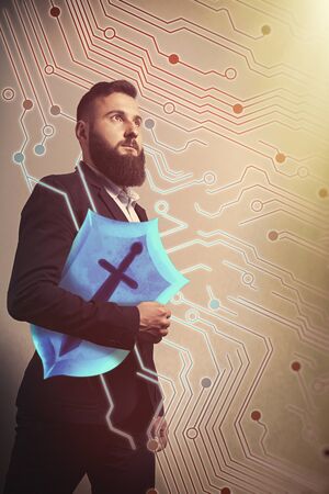 Bearded man with shield in his hand. Specialist on information and network security. Concept
