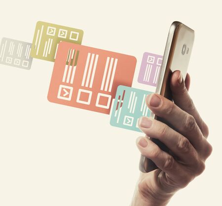 Icons of questionnaires stick out of a smartphone screen. Concept of online testing, questionnaires, voting.の写真素材