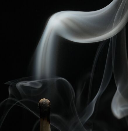 Smoke on a burnt match. Close-up. Macro photography.の写真素材