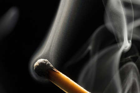 Smoke on a burnt match. Close-up. Macro photography.