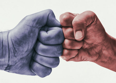 Clash of two fists on toned background. Concept of confrontation, fight, domestic violence.の写真素材