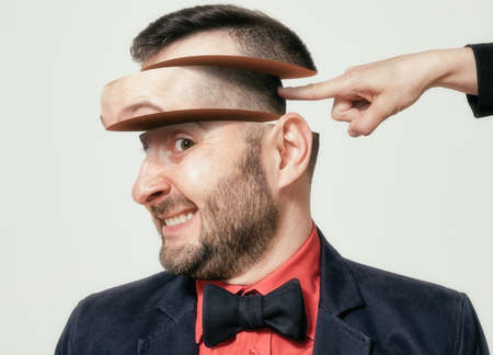 She drives me crazy. Creative funny portrait of a crazy man. Madness concept. Mental health.の写真素材
