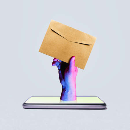 Get your message. Art collage with smartphone and envelope.の写真素材