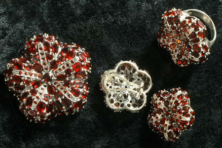 Pomegranates in silver on a black velvetの写真素材