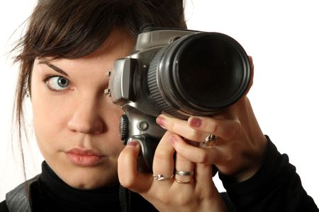 The beautiful girl with a camera on a white backgroundの写真素材