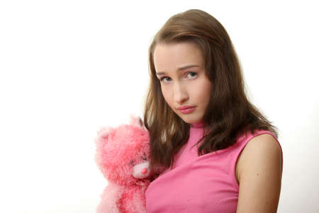 The girl with a pink teddy bearの写真素材