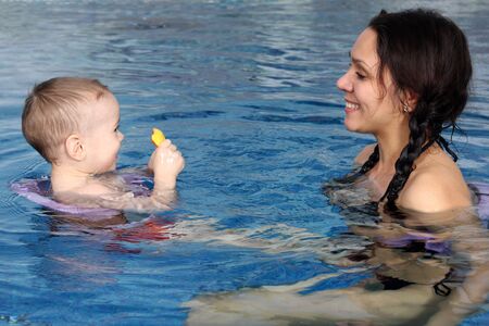 Mum with the son bathe in poolの写真素材