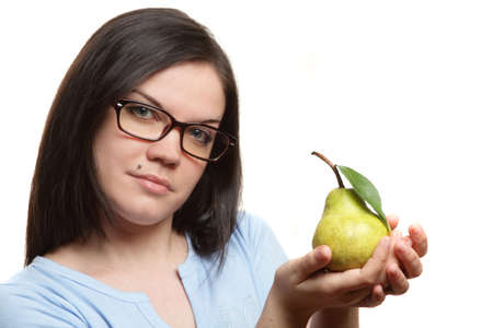 The beautiful girl to a wearing spectacles and blue blouse has control over a pearの写真素材