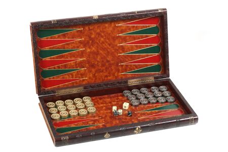 backgammon in the carved box inlaid with skin, counters and bones on a white background