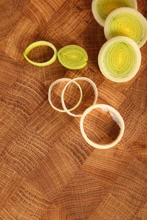The leek cut by circles on a chopping boardの写真素材