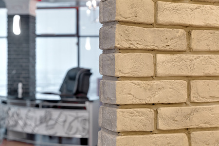 entrance to office room behind a brick wallの写真素材