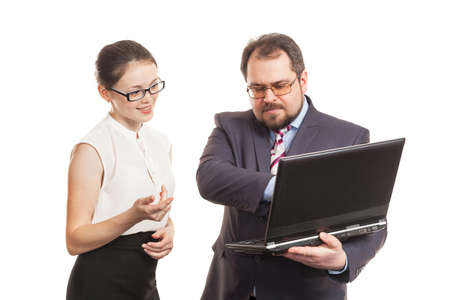 partners conduct negotiations standing and look at the laptop