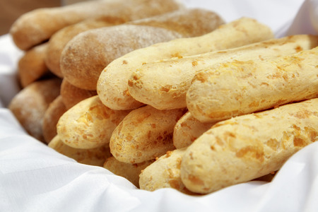 fresh baguettes on white fabric close up