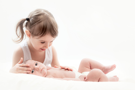 elder sister with the newborn childの写真素材