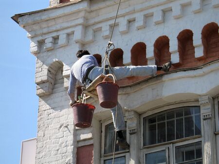 Man washing old building.の写真素材