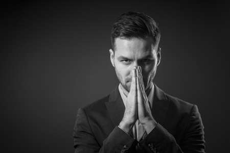 Decision-making. A White-collar Businessman Decides How to Develop the Business. Crisis Concept. Black and White Portrait. High quality photoの写真素材