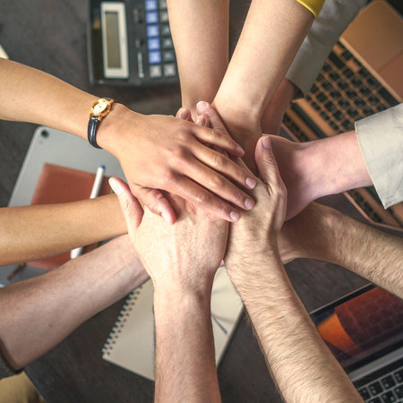 Collaboration, teamwork, and partnership. Trust and unity in collective goals within professional and corporate environment. Partners express success with pressing their fists together in handshake. . High quality photoの写真素材