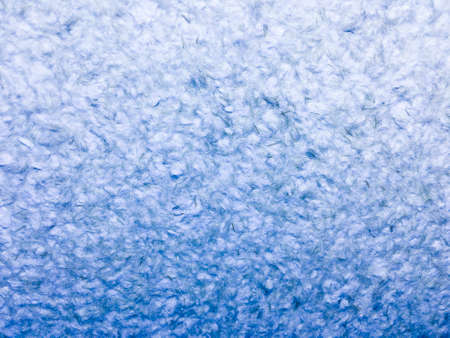 Close-up of the texture of a woolen fabric. Blue backgroundの写真素材