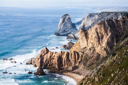 Beautiful photo depicting rocks, sea and vegetation. The place where the earth ends and the sea begins, Cabo da Roca (Cape Roca), Sintra, Portugalの写真素材