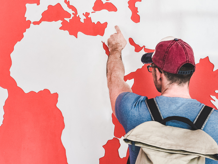 Man looking at the world map