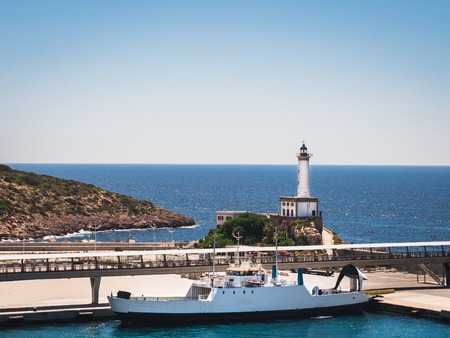 Seascape. Ship on the background of a coastline and a clear blue skyの写真素材
