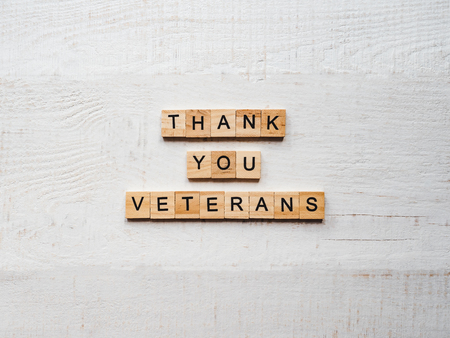 Beautiful greeting card on Veterans Day. Top view, close-up, isolated backgroundの写真素材