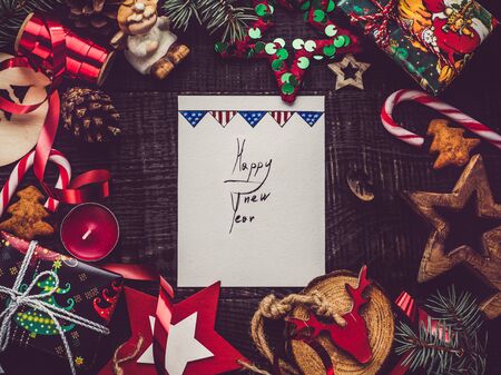 Merry Christmas and Happy New Year. Beautiful card with Christmas decorations. View from above, close-up, flat lay. Congratulations to loved ones, family, relatives, friends and colleaguesの写真素材