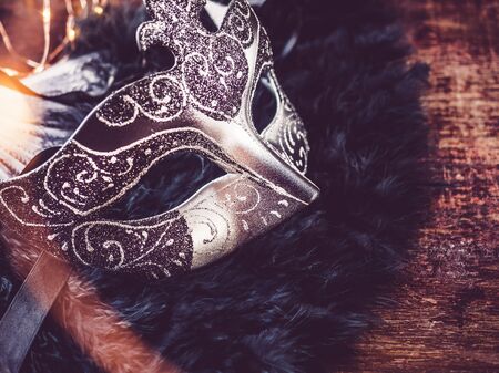 Carnival mask on the background of piano keys