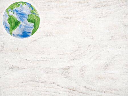 Earth Day. Beautiful greeting card. Isolated background, close-up, view from above, wooden surface. Congratulations for relatives, friends and colleaguesの写真素材