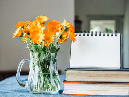 Beautiful, bright bouquet of flowers on a white, wooden table. Side view, close-up