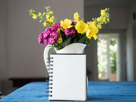 Beautiful flowers lying on a wooden table