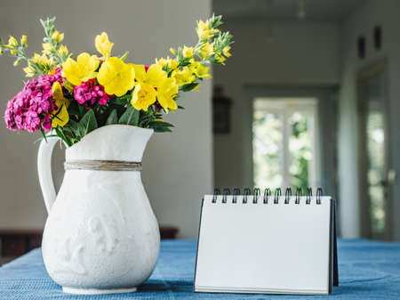 Beautiful flowers lying on a wooden tableの写真素材