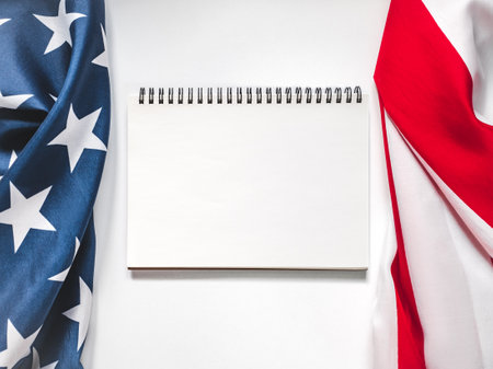 American Flag on white background and space for Your congratulatory inscription. Greeting card. Studio shot. Congratulations for family, loved ones, relatives, friends and colleaguesの写真素材